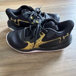 Under Armour Black and Gold Sneakers with Mesh Upper